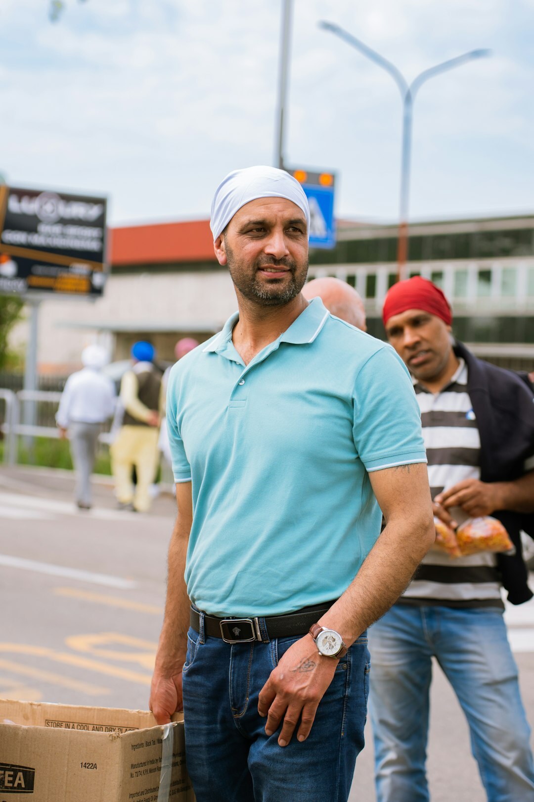 Turkish male journalist smiling outdoors