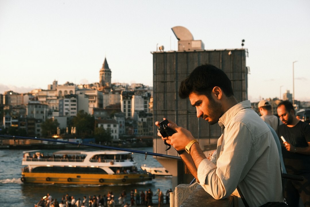 Turkish male photo editor with camera portrait