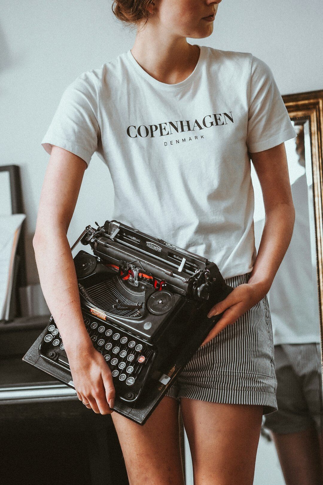 Journalist typing on a vintage typewriter